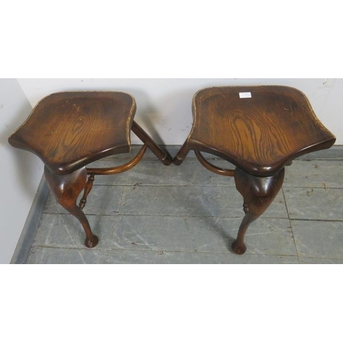 870 - A pair of Georgian style oak three-legged stools, on cabriole front supports and canted rear support... 