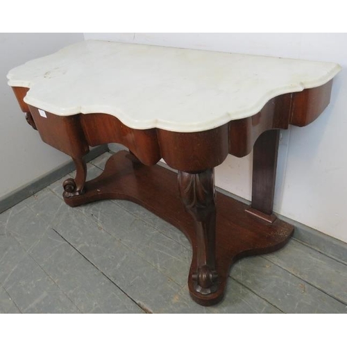 872 - A Victorian mahogany console table, with a white marble shaped top, above a central blind drawer, on... 