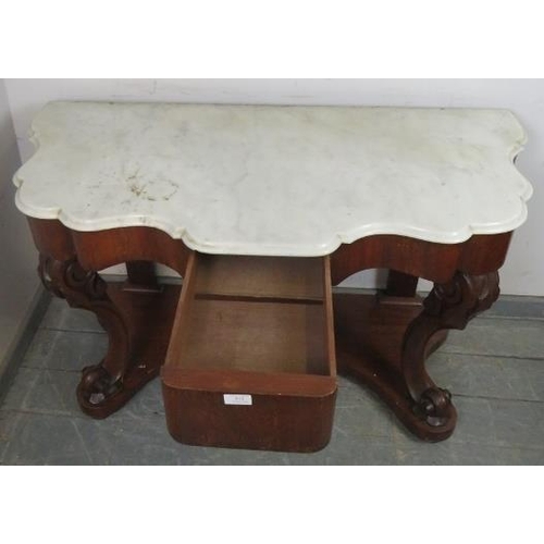 872 - A Victorian mahogany console table, with a white marble shaped top, above a central blind drawer, on... 