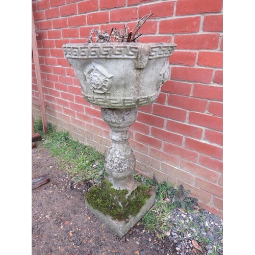 897 - A nicely weathered reconstituted stone garden planter with Greek key detail, on a baluster column wi... 