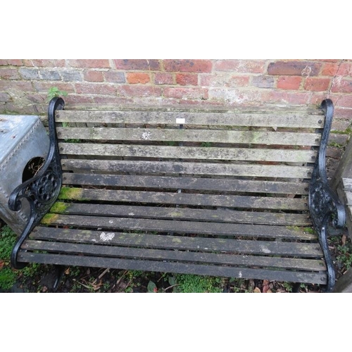 898 - A vintage scroll back garden bench, with pierced end supports painted black. 
H78cm W128cm D64cm (ap... 