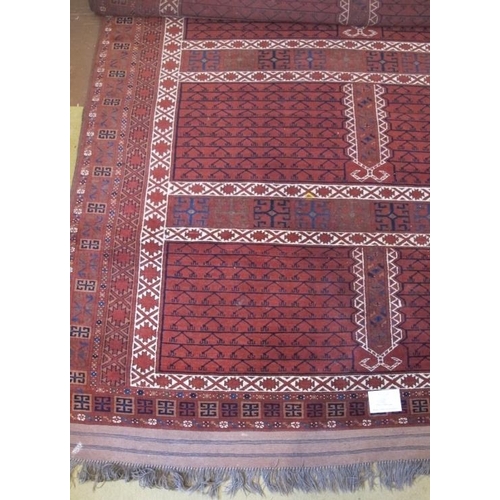 916 - A 20th century (Afghan Hatchli) carpet, repeat pattern on terracotta field. Condition good. 260 cm x... 