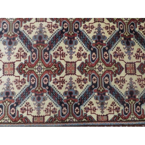 923 - North West Persian Ardebil runner, geometric design in blues on beige ground, border of blues. 286cm... 