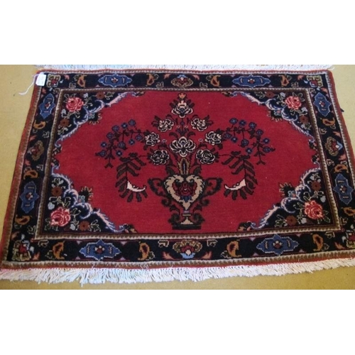 930 - A fine pair of unused Mehraban (Hamadan region) mats. Ruby field with vase of flower motif and styli... 