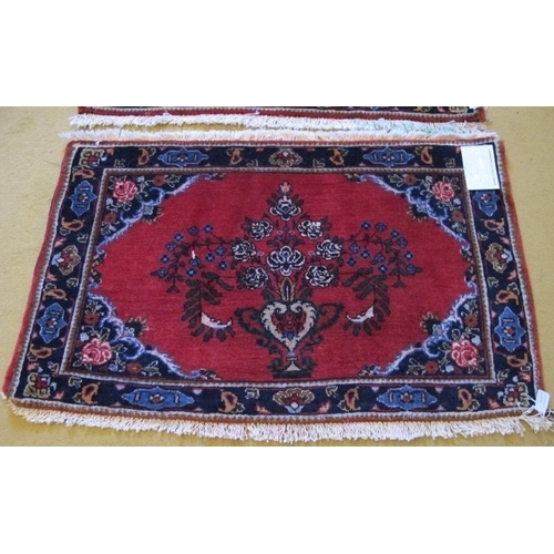 930 - A fine pair of unused Mehraban (Hamadan region) mats. Ruby field with vase of flower motif and styli... 