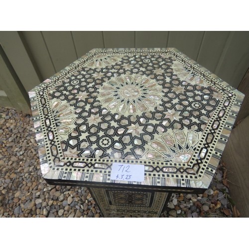 712 - A highly decorative Moorish octagonal occasional table, with mother of pearl and bone geometric inla... 