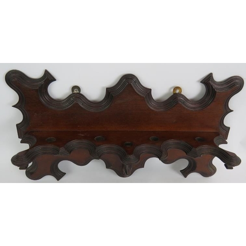 56 - An ornate Edwardian mahogany pipe rack, a cast brass aesthetic movement pipe rack and two tobacco pi... 