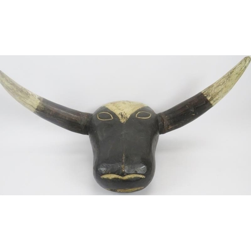 100 - African carved wood cow head mask, paint and pigment, 16