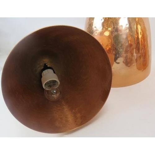 108 - Four copper lamp shades. Dome beaten design with matching fittings, each 8