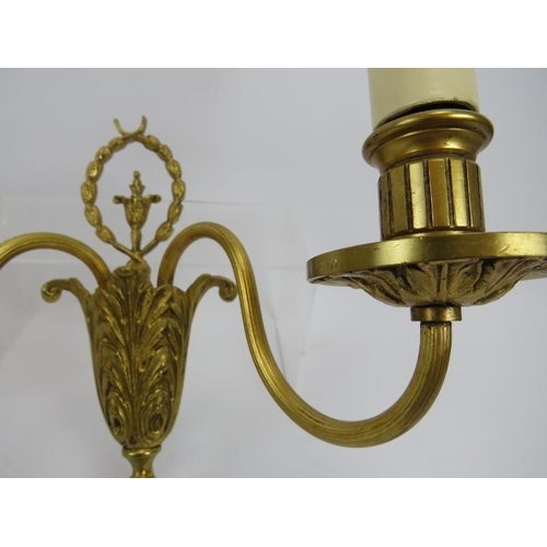 11 - A pair of Neo Classical revival cast gilt-metal twin-branch wall lights. 9.1 in (23 cm) height. 
Con... 