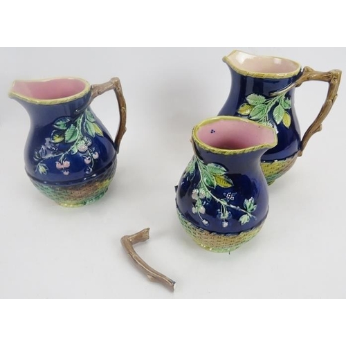 114 - Set of three Majolica Blackberry pattern jugs in graduated sizes. Largest 8