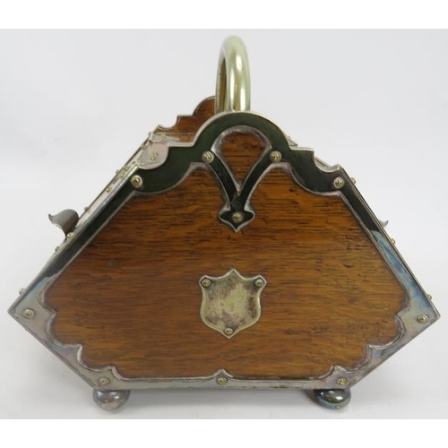 118 - A Victorian double compartmented biscuit box. The miniature oak box of coal scuttle form with metal ... 