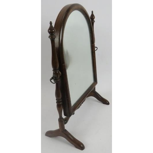 119 - Mahogany swing toilet mirror. Dome top to mirror between turned supports. 17.5 in (44 cm) height x 1... 