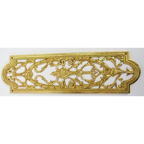 12 - A set of ten Neo Classical revival cast and pierced gilt-metal door finger plate push plates. Each a... 