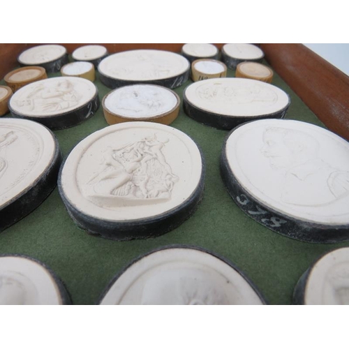 17 - A large collection of Italian Grand Tour Plaster Intaglios. Displayed in two trays, each tray with h... 