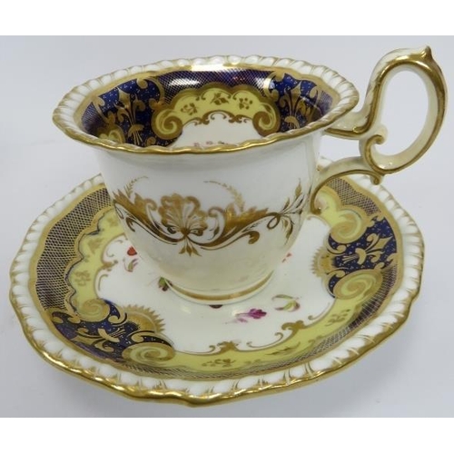 19 - A set of four porcelain cups and saucers, 19th century. With lavish gilt trim, blue borders and enam... 