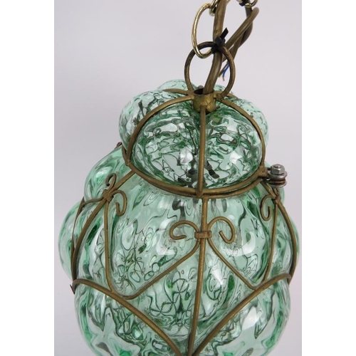 33 - An Italian Seguso Murano glass pendant lamp, circa 1960s. Hand blown into a wire cage with pale gree... 