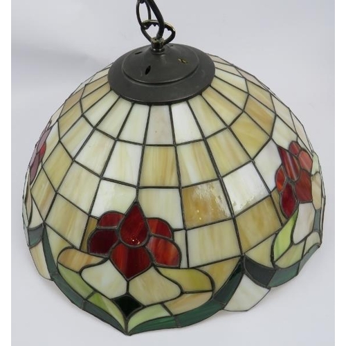 36 - Three stylish Tiffany style ceiling pendant lights. Decorated in the traditional leaded-light and co... 