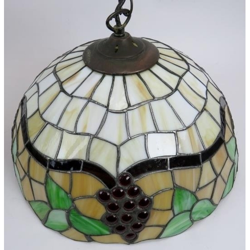 36 - Three stylish Tiffany style ceiling pendant lights. Decorated in the traditional leaded-light and co... 