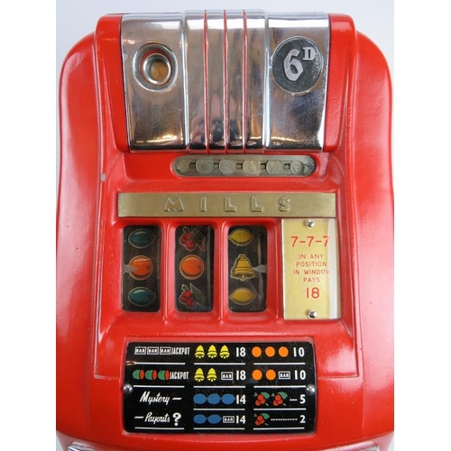 49 - An original vintage Mills three drum one arm bandit slot machine. Red and cream with chrome mounts. ... 