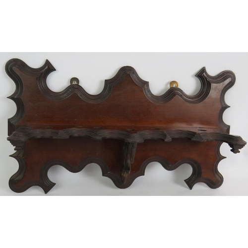 56 - An ornate Edwardian mahogany pipe rack, a cast brass aesthetic movement pipe rack and two tobacco pi... 