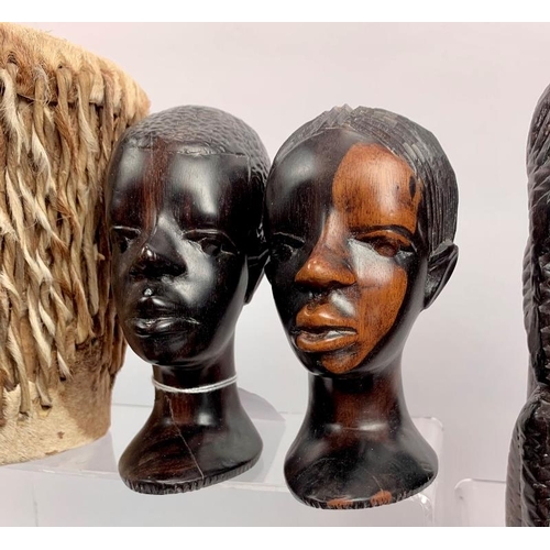 57 - Collection of African carved figures and heads. Assorted hard woods and zebra skin drum, 16cm height... 