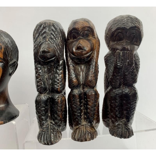 57 - Collection of African carved figures and heads. Assorted hard woods and zebra skin drum, 16cm height... 