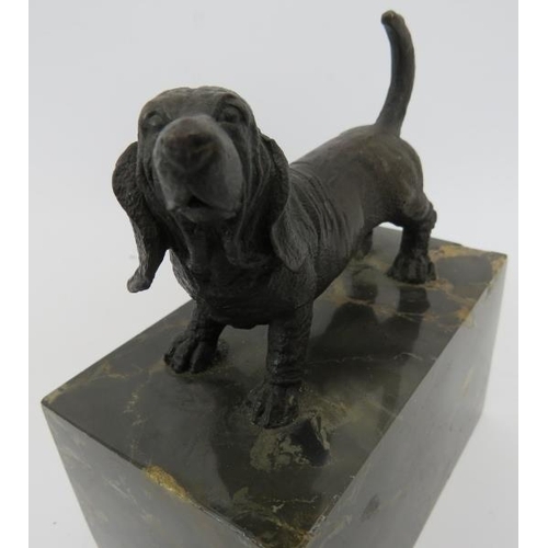 62 - A bronzed sculpture of a hound. Raised on a marble plinth base, total height 15cm.
Condition report:... 