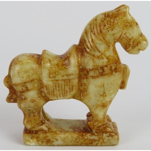 76 - A Chinese carved russet Jade standing horse, with saddle, on plinth base, Ming style but likely Qing... 