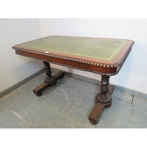 703 - A William IV rosewood library table, with gadrooned edging and inset gilt tooled green leather writi... 