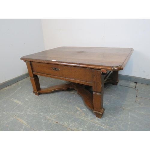 706 - An 18th century and later French oak coffee table with rounded corners, the top sliding to reveal a ... 