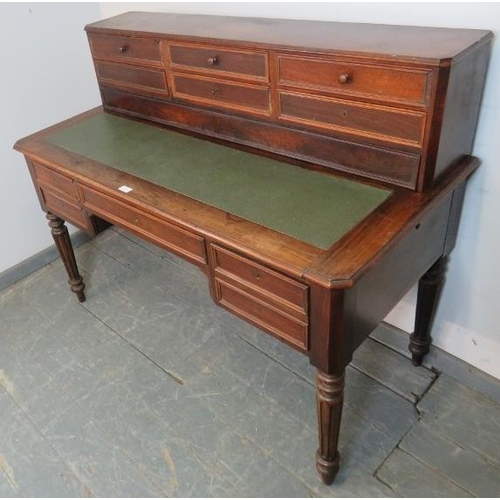 716 - A 19th century French rosewood writing desk, the upper gallery housing six short drawers, over a bas... 