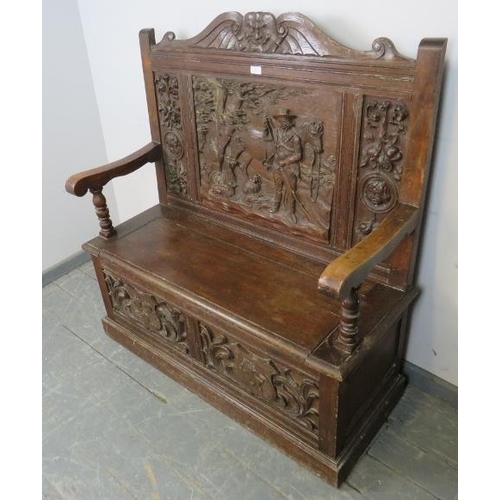 717 - A 19th century high back oak settle, ornately carved in the 17th century taste with figural scene de... 