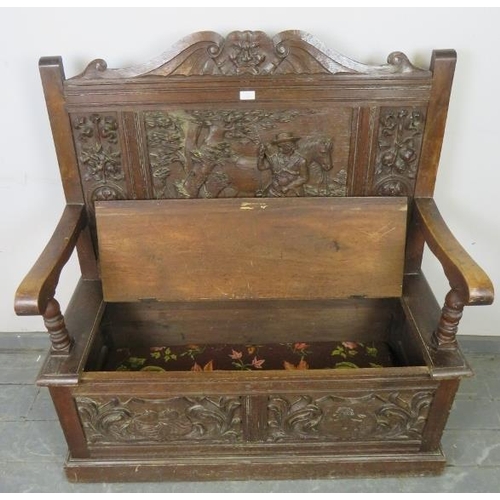 717 - A 19th century high back oak settle, ornately carved in the 17th century taste with figural scene de... 