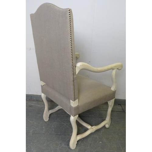 725 - An antique style bleached oak open-sided armchair in the French taste, upholstered in grey material ... 