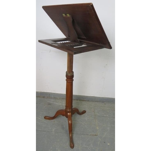 727 - A 19th century mahogany music stand, with ratchet height adjust, on splayed tripod supports.
H102cm-... 