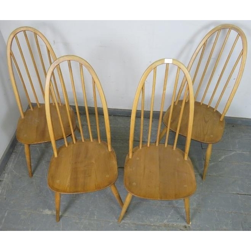 735 - A set of four mid-century ‘Windsor Quaker’ elm and beech blonde dining chairs by Ercol, on canted su... 