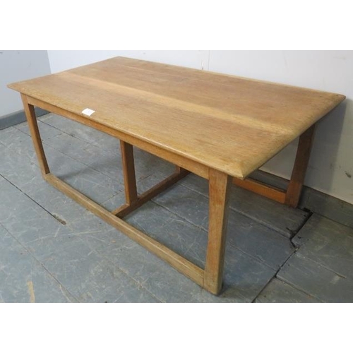 738 - A heavy Art Deco Period light oak coffee table in the manner of Heal’s, on rail supports with a doub... 