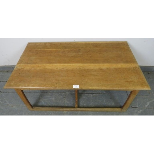 738 - A heavy Art Deco Period light oak coffee table in the manner of Heal’s, on rail supports with a doub... 