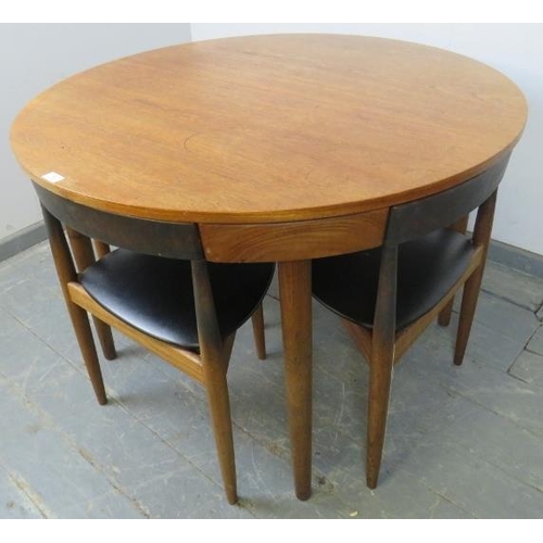 739 - A mid-century Danish teak dining set by Frem Rojle, the table with butterfly-leaf extension, on tape... 