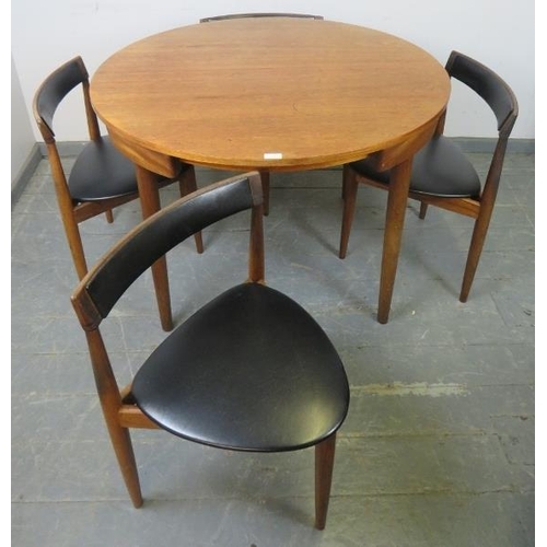 739 - A mid-century Danish teak dining set by Frem Rojle, the table with butterfly-leaf extension, on tape... 