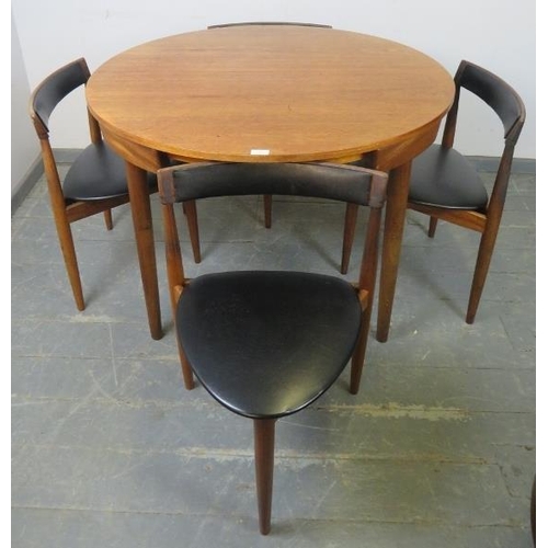 739 - A mid-century Danish teak dining set by Frem Rojle, the table with butterfly-leaf extension, on tape... 