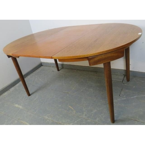 739 - A mid-century Danish teak dining set by Frem Rojle, the table with butterfly-leaf extension, on tape... 