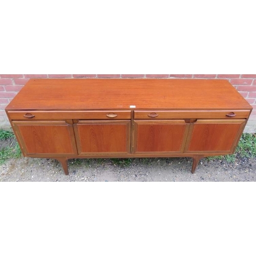 740 - A mid-century teak sideboard by Greaves & Thomas, housing two short drawers over cupboards with fitt... 