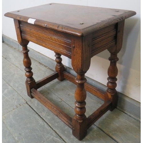 744 - A reproduction oak joint stool in the 18th century taste, on baluster turned supports with stretcher... 