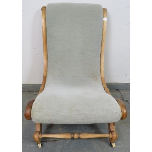 751 - A Victorian beech slipper chair, upholstered in grey material with silver braiding, on scrolled supp... 