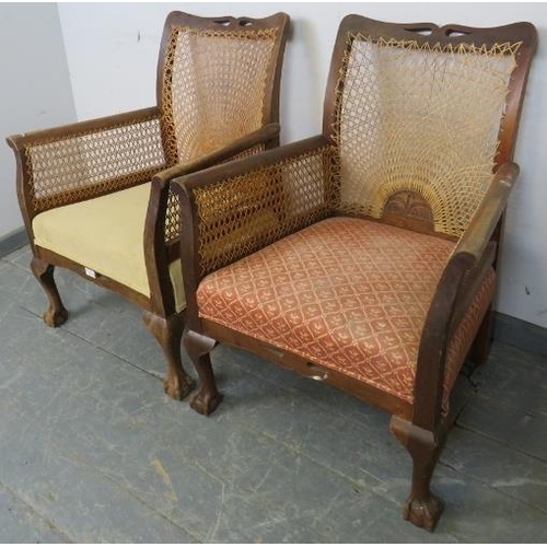 753 - A pair of 1920s walnut his & hers bergère armchairs, on cabriole supports with claw & ball feet. 
H8... 