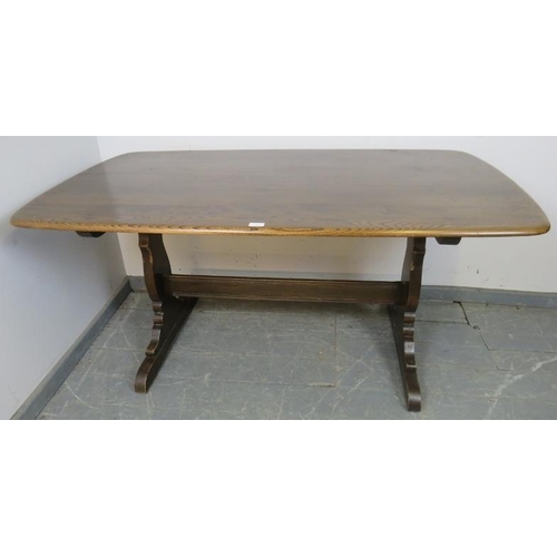 756 - A mid-century elm refectory dining table by Ercol, on shaped supports with a middle stretcher. 
H72c... 