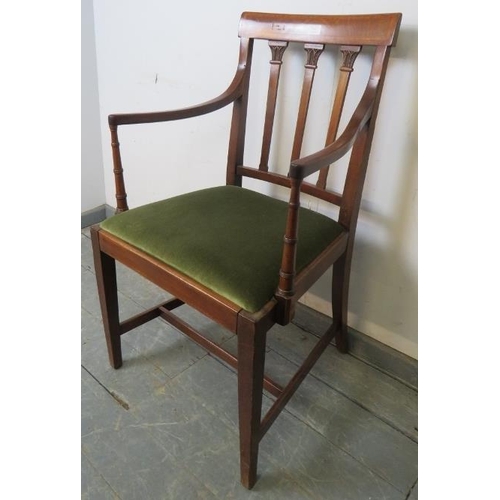 757 - An Edwardian mahogany elbow chair, with inlaid backrest and spindles featuring carved capitals, on t... 