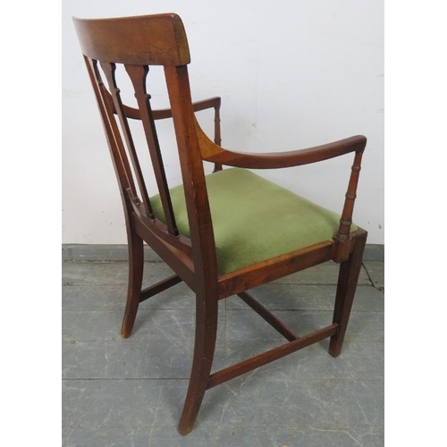 757 - An Edwardian mahogany elbow chair, with inlaid backrest and spindles featuring carved capitals, on t... 